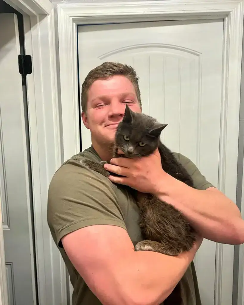 Garrison Brown with newly adopted cat Ms Buttons