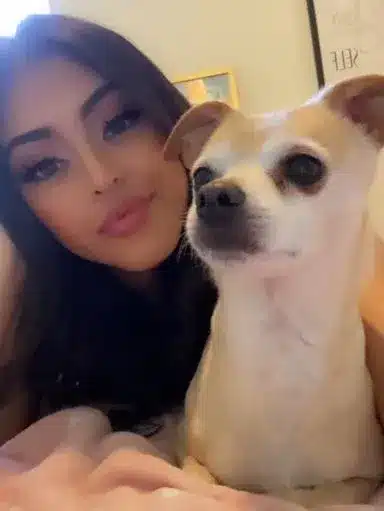 Among three pets, this is the Photo of Sophia Leone with one of her pet dog