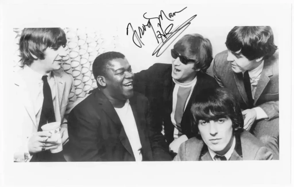 Photo of Clarence “Frogman” Henry with the Beatles